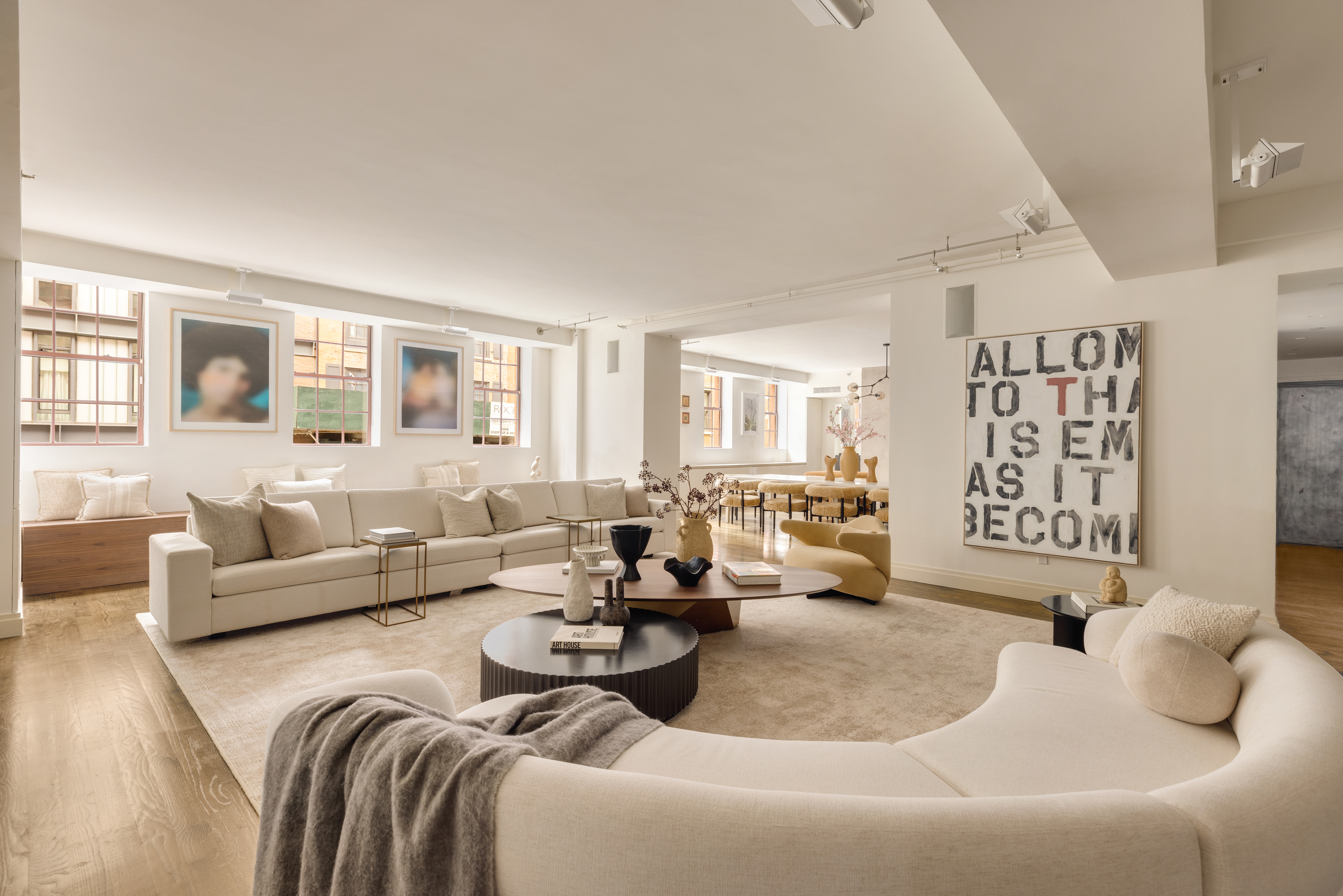 18 Leonard Street, Unit 2D Manhattan, NY 10013 - Photo 2 of 22 a living room with furniture and large windows