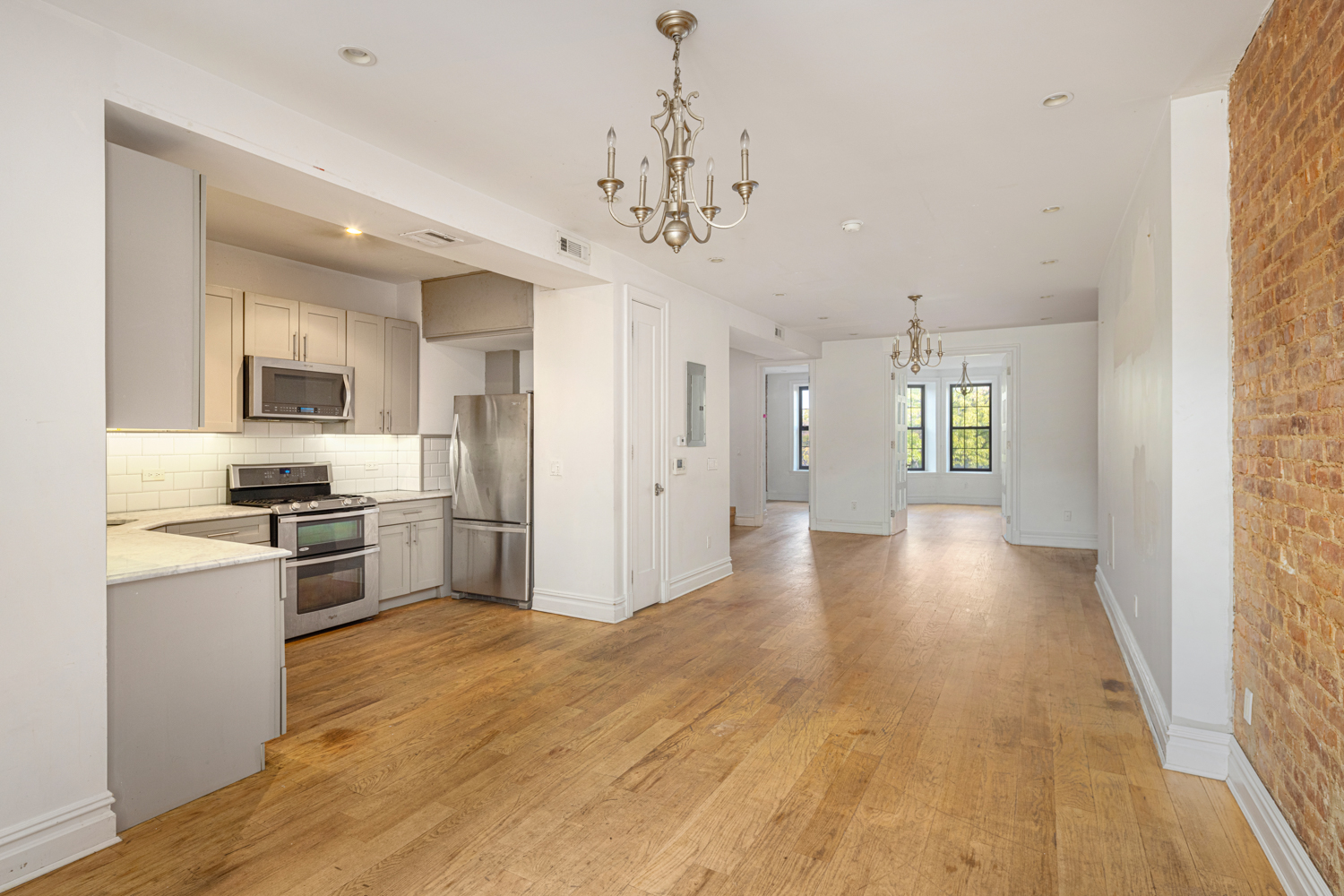 912 Eastern Parkway, Unit 1 Brooklyn, NY 11213 - Photo 3 of 11 a view of a kitchen with a sink a refrigerator and window
