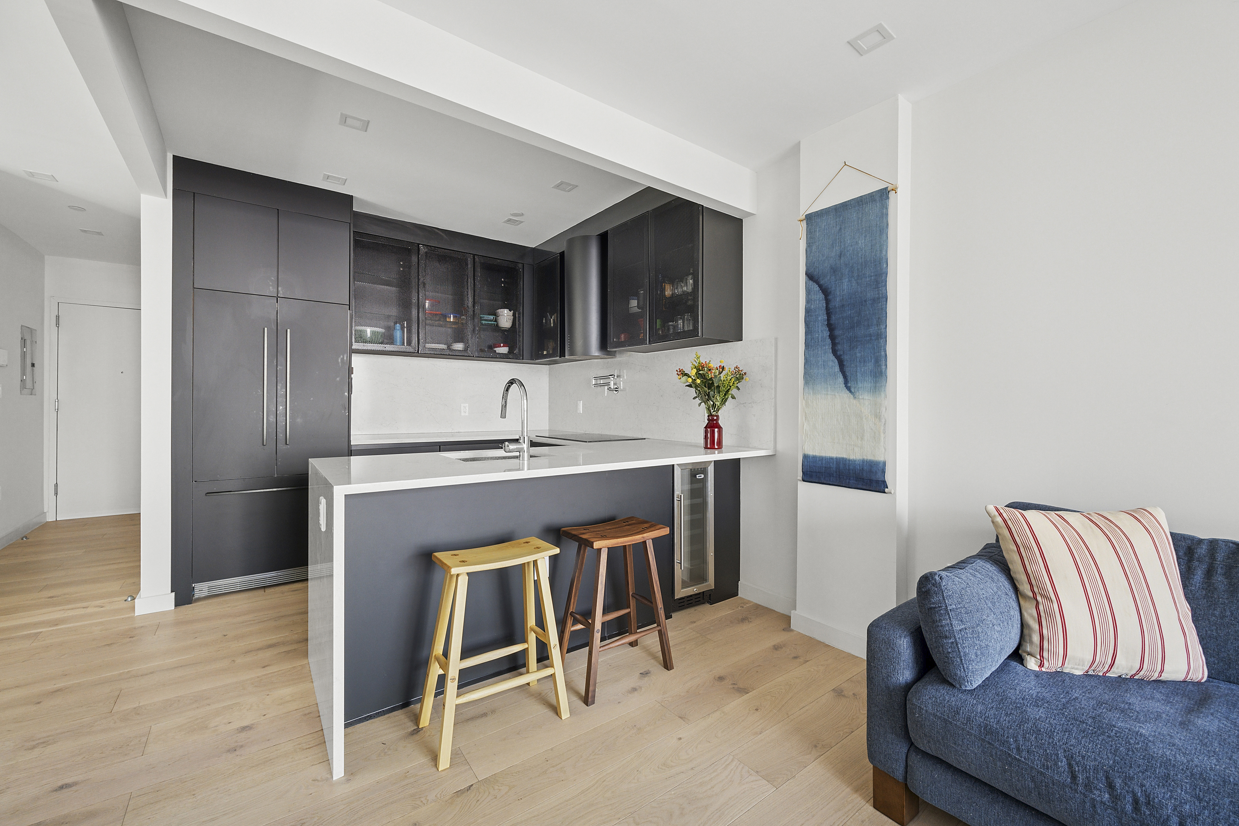 156 Devoe Street, Unit 3F Brooklyn, NY 11211 - Photo 3 of 9 a room with furniture and a wooden floor