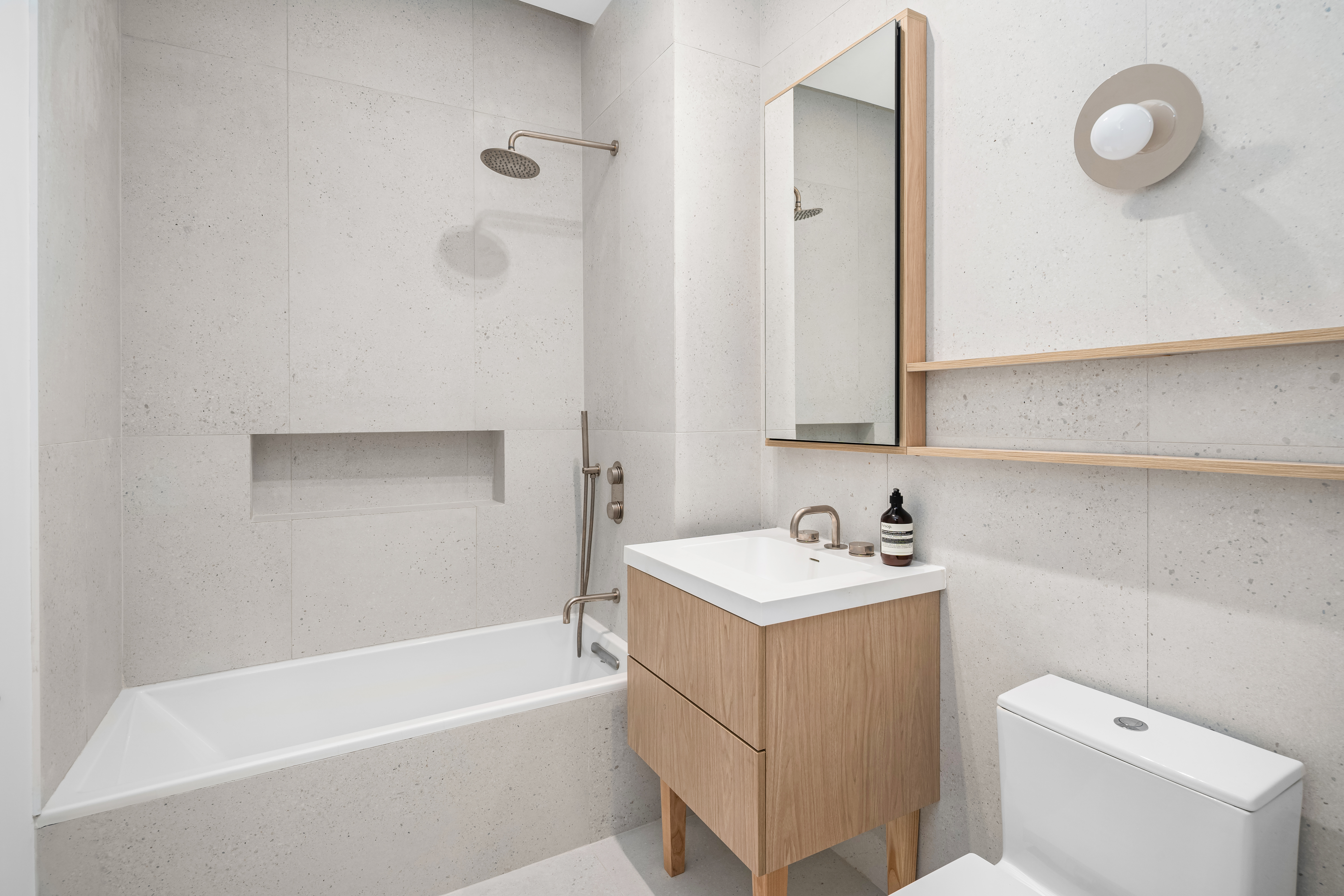 79 South 2nd Street, Unit 2 Brooklyn, NY 11249 - Photo 8 of 14 a bathroom with a sink a toilet and shower