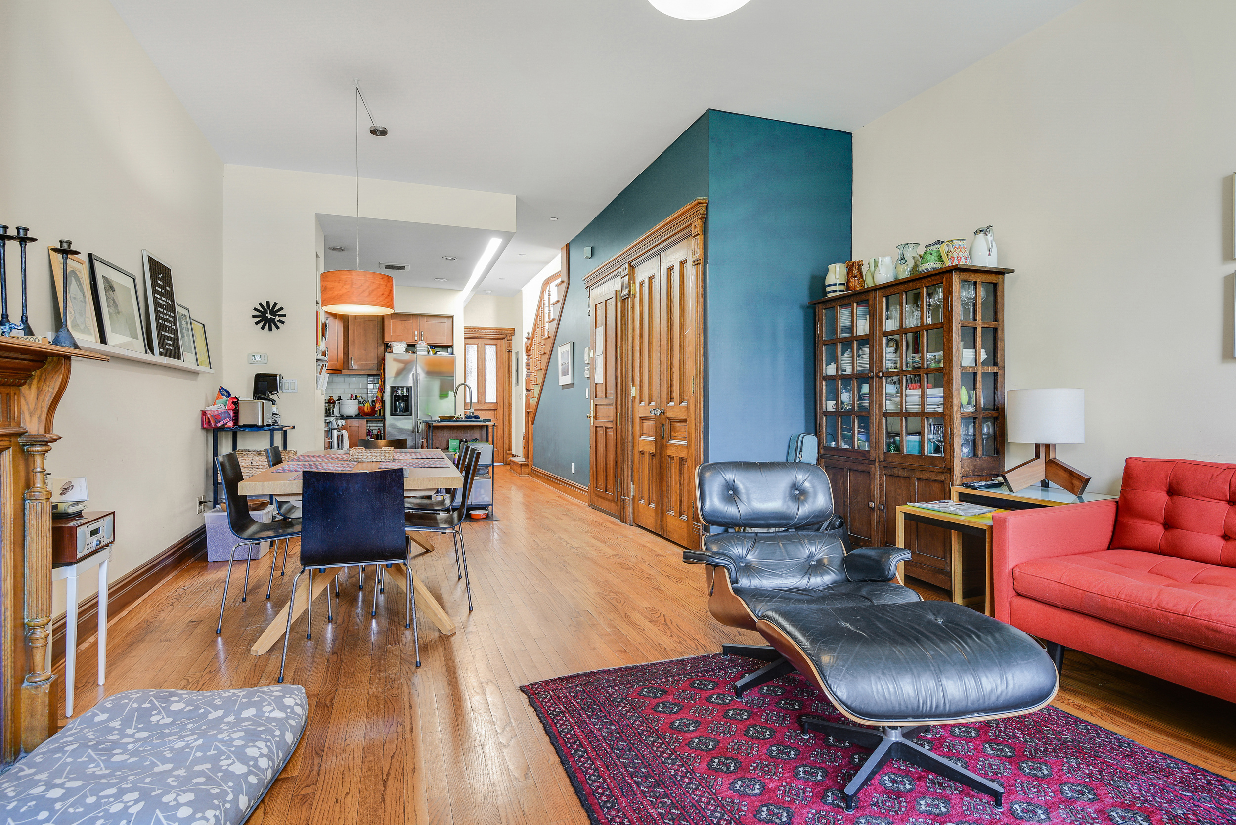 347 West 121st Street Manhattan, NY 10027 - Photo 6 of 16 a living room with furniture fireplace and a large window