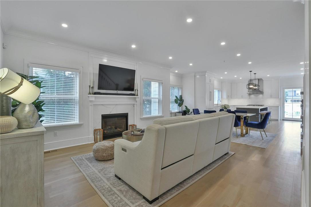 211 Purchase Street, Unit A Rye, NY 10580 - Photo 5 of 22 a living room with furniture a flat screen tv and a fireplace
