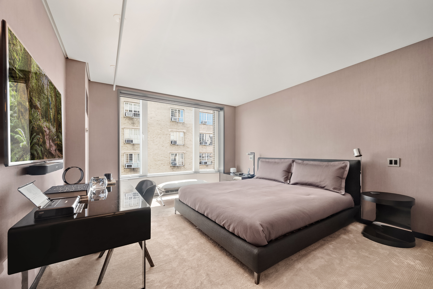 279 Central Park West, Unit 8B Manhattan, NY 10024 - Photo 5 of 15 a bedroom with a bed a table and large windows