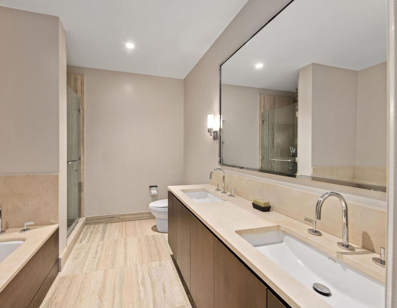 260 Park Avenue South, Unit 6I Manhattan, NY 10010 - Photo 5 of 9 a bathroom with a sink and a mirror