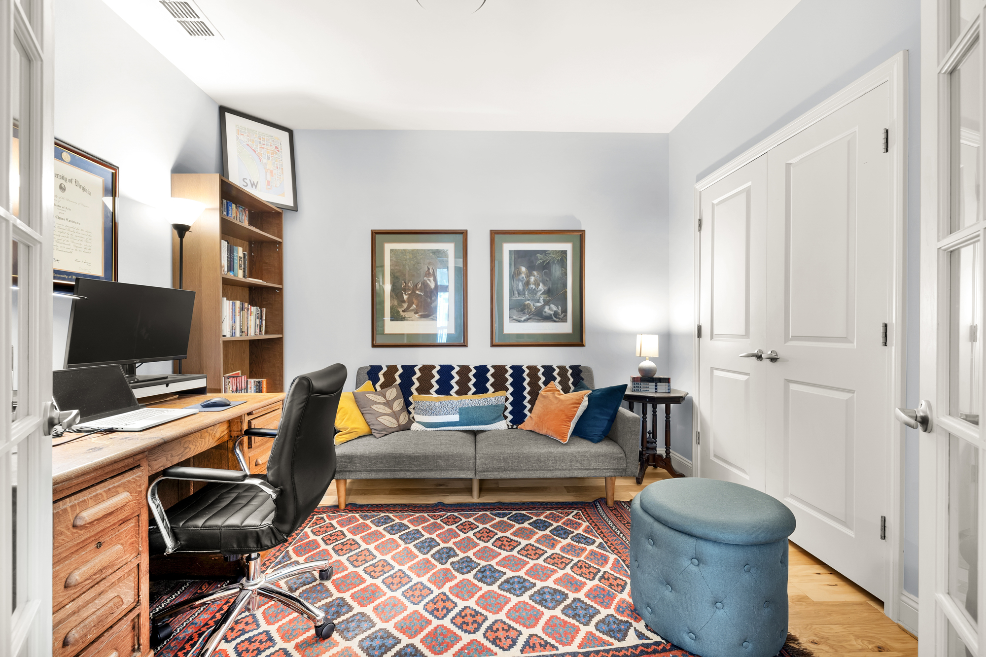 1391 Pennsylvania Ave. Southeast, Unit 324 Washington, DC 20003 - Photo 15 of 33 a living room with furniture and a flat screen tv