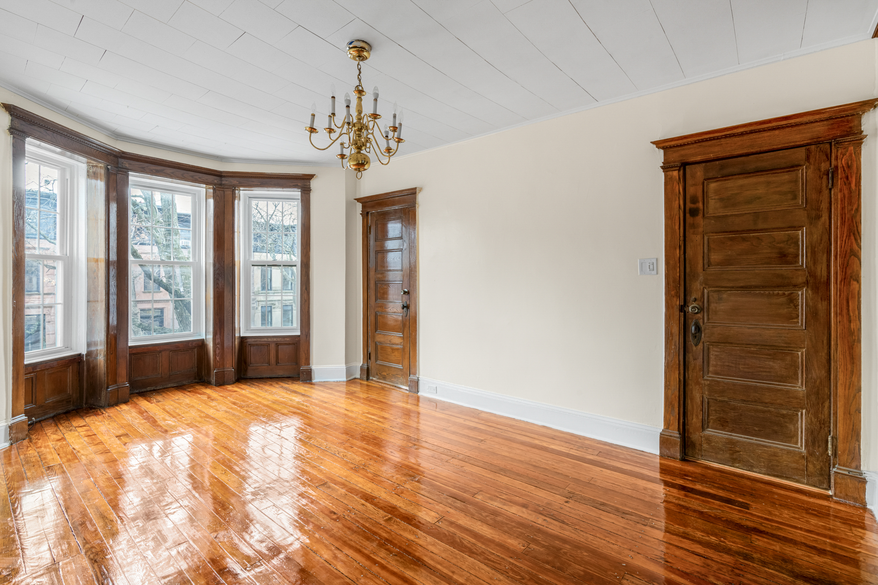601 Jefferson Avenue, Unit 2 Brooklyn, NY 11221 - Photo 1 of 8 a view of a room with wooden floor and windows