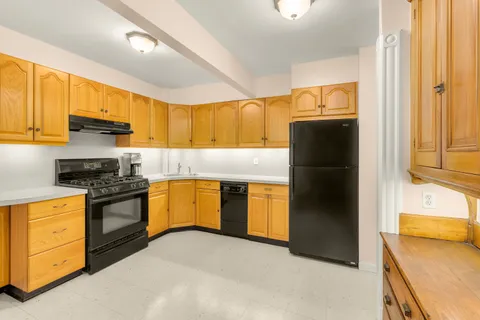a view of balcony with wooden floor and seating space