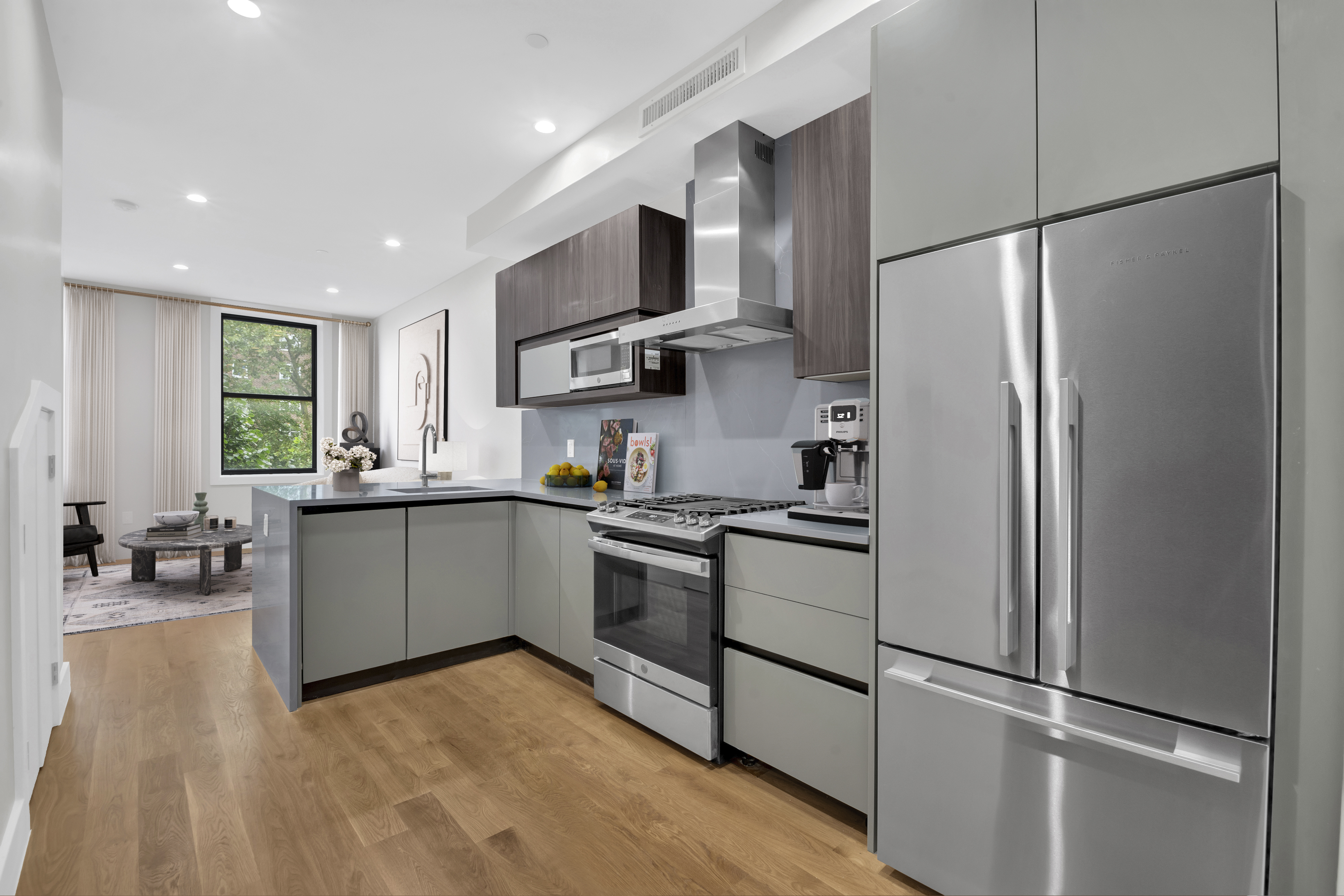 265 West 131st Street, Unit 2 Manhattan, NY 10027 - Photo 5 of 6 a kitchen with stainless steel appliances granite countertop a refrigerator sink and stove