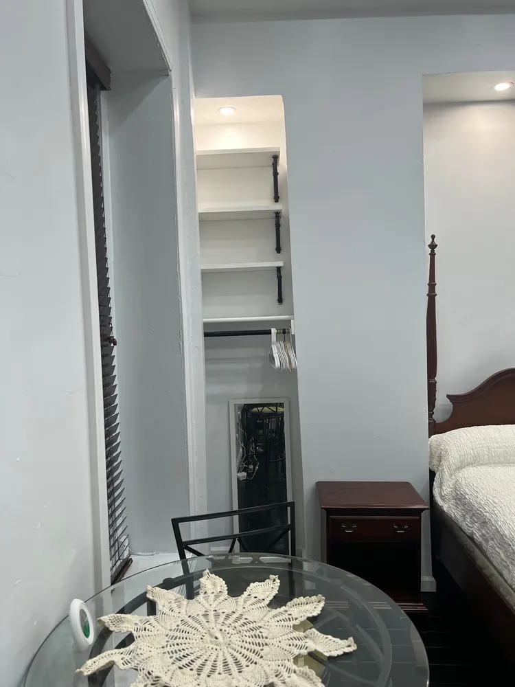 a bedroom with a bed and a fireplace