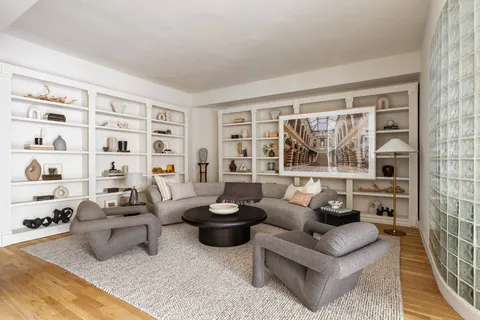 a living room with furniture and a window