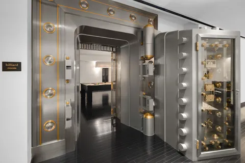 a bathroom with a glass shower door and a sink