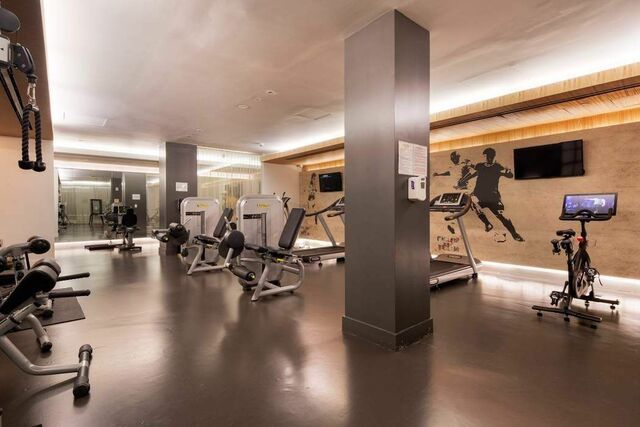 93 Worth Street, Unit 406 Manhattan, NY 10013 - Photo 7 of 11 a view of a room with gym equipment