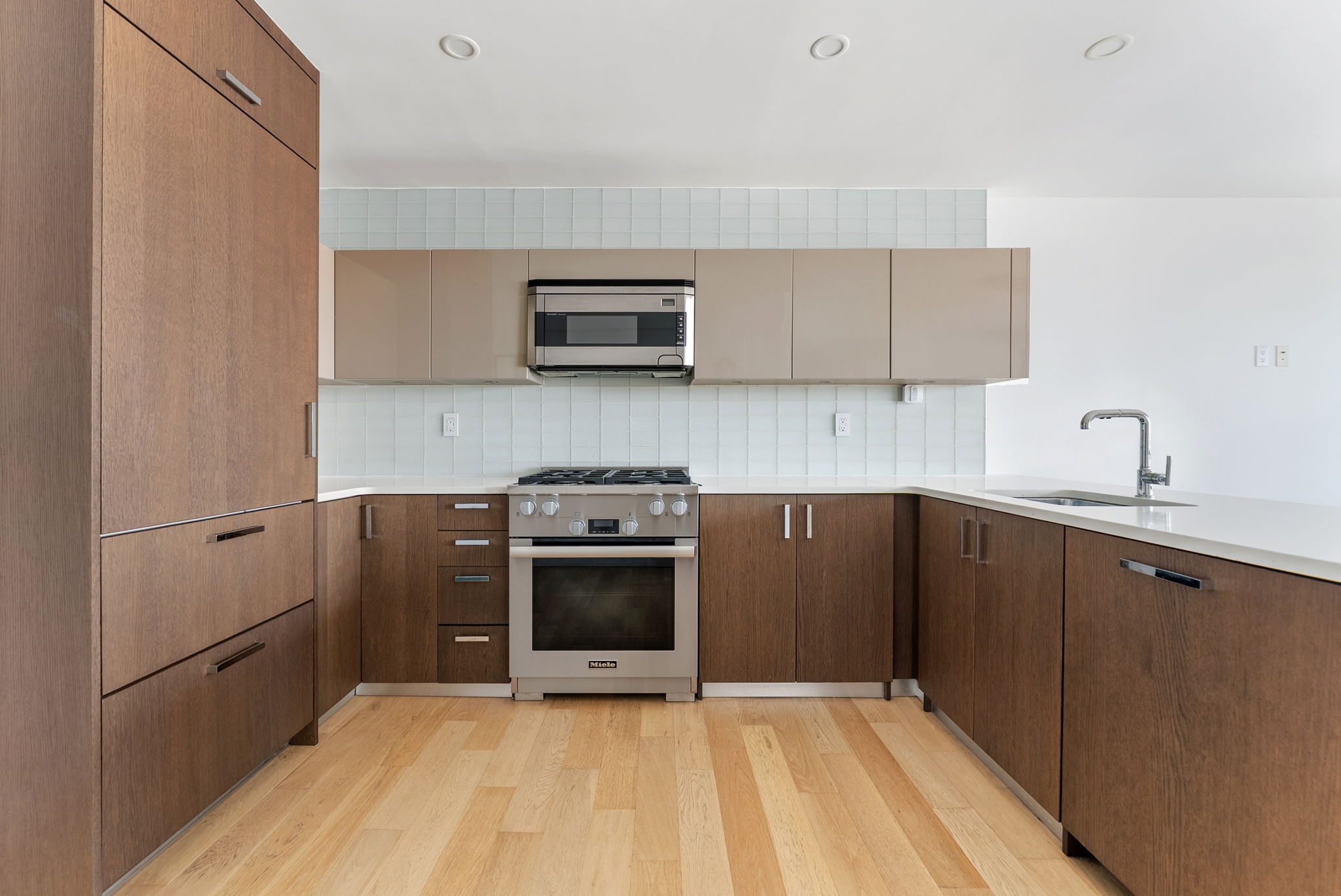 175 West 95th Street, Unit 15D Manhattan, NY 10025 - Photo 5 of 13 a kitchen with stainless steel appliances a stove sink and microwave