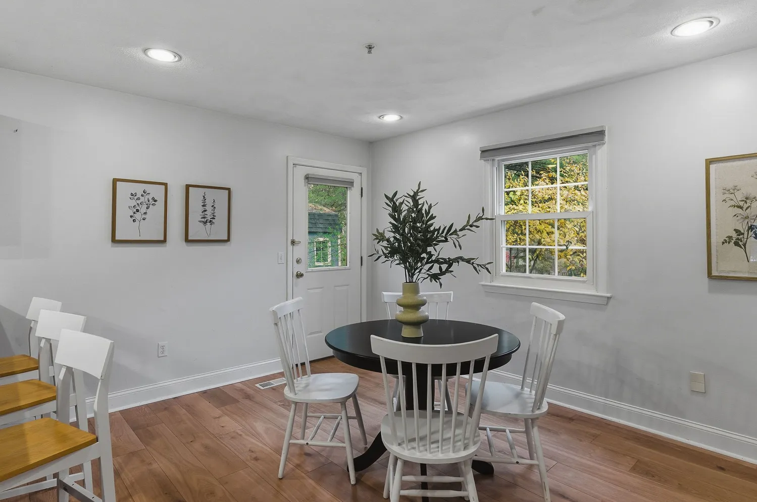 a view of a dining room with furniture and window