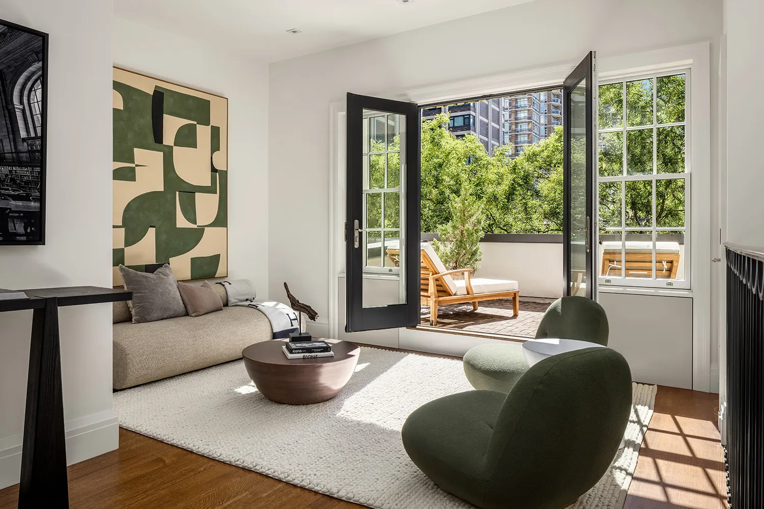 a living room with furniture and floor to ceiling windows