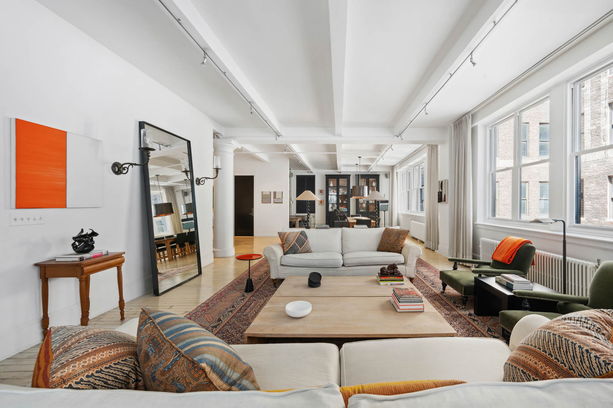 7 East 20th Street, Unit 6R Manhattan, NY 10003 - Photo 2 of 14 a living room with furniture and a large window