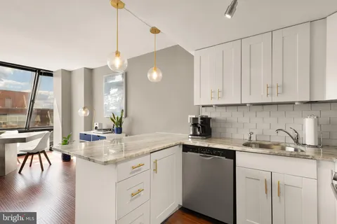 a kitchen with sink cabinets and window