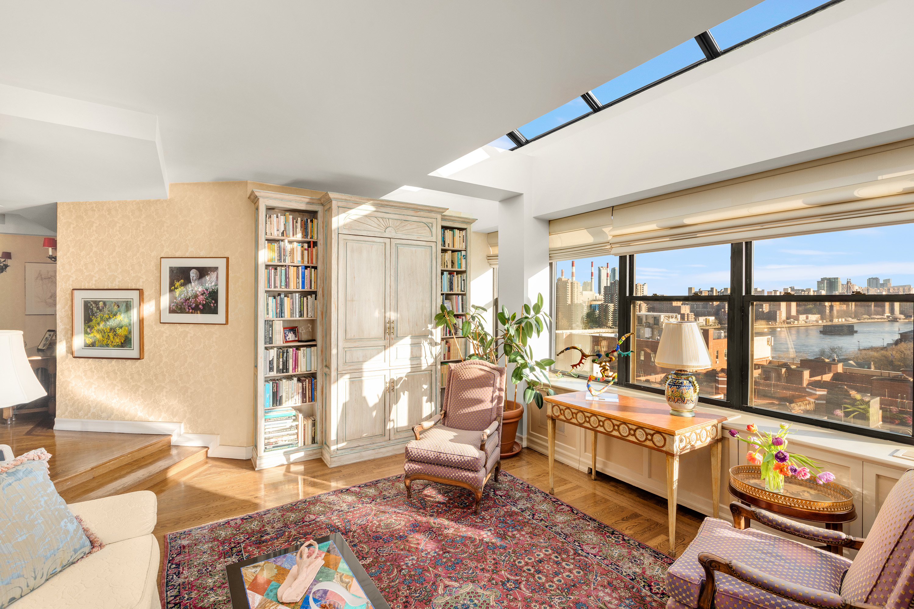 2 East End Avenue, Unit PHG Manhattan, NY 10075 - Photo 2 of 15 a living room with furniture and a floor to ceiling window