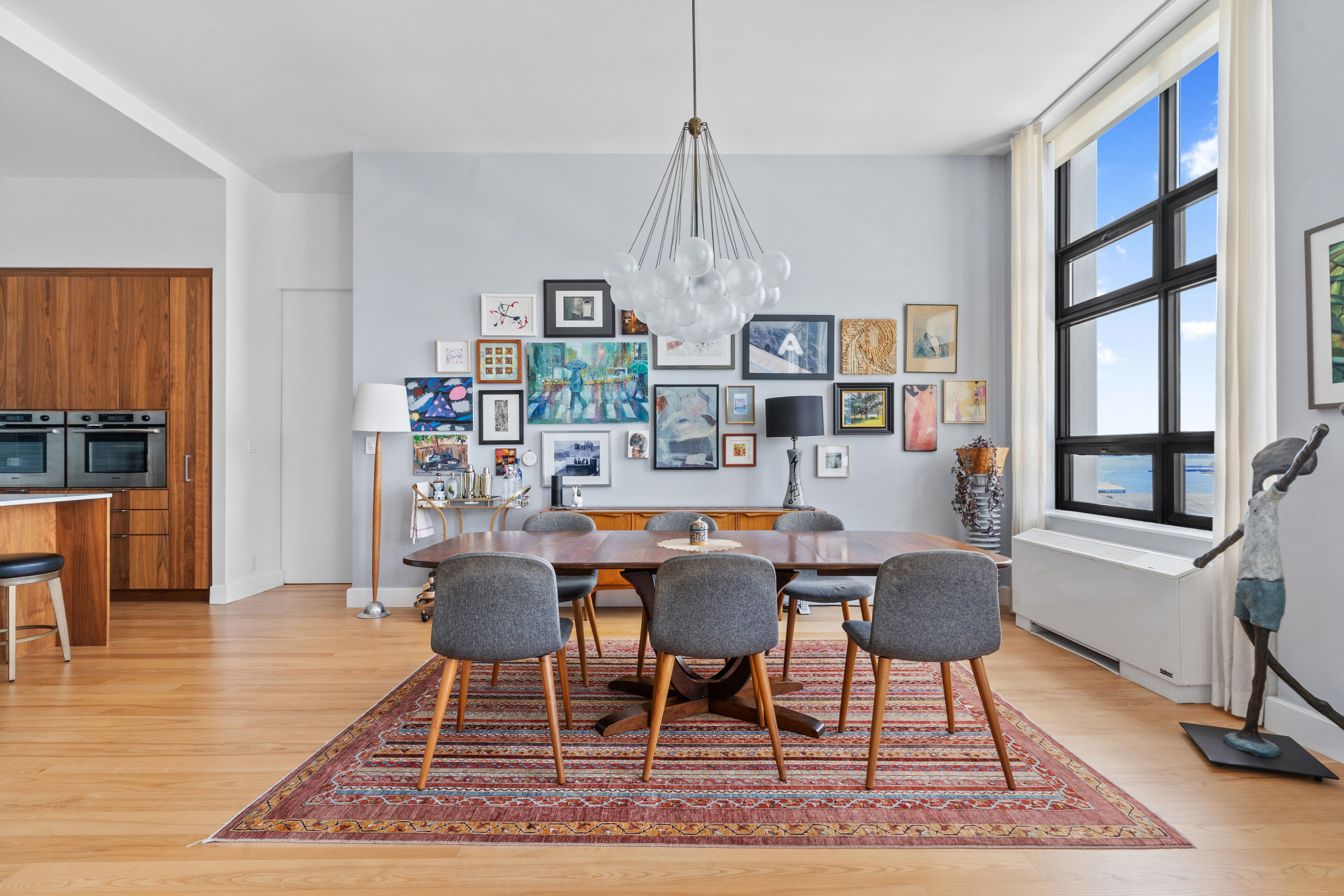 360 Furman Street, Unit 734 Brooklyn, NY 11201 - Photo 7 of 31 a dining room with furniture a rug and wooden floor