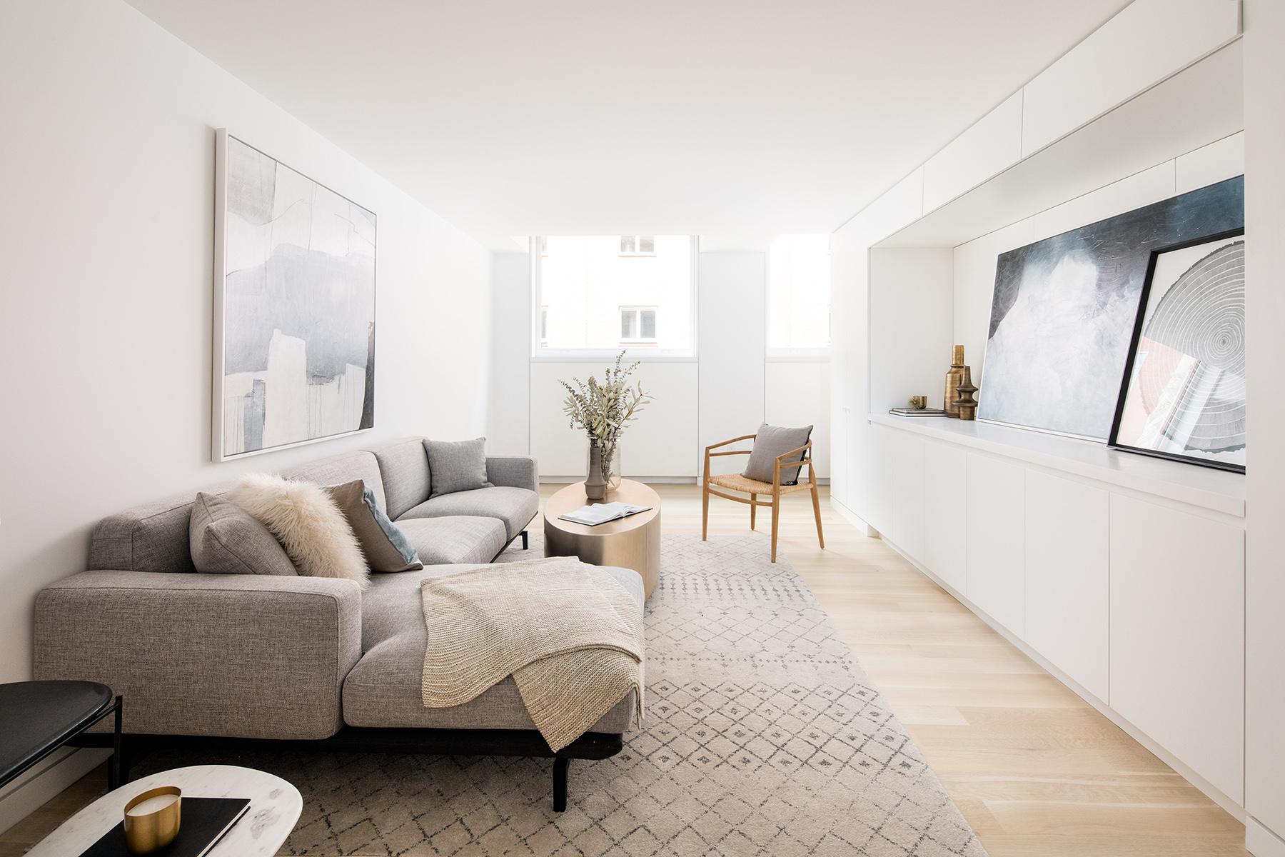 67-69 Franklin Street, Unit 2B Manhattan, NY 10013 - Photo 6 of 16 a living room with furniture and a large mirror next to a window
