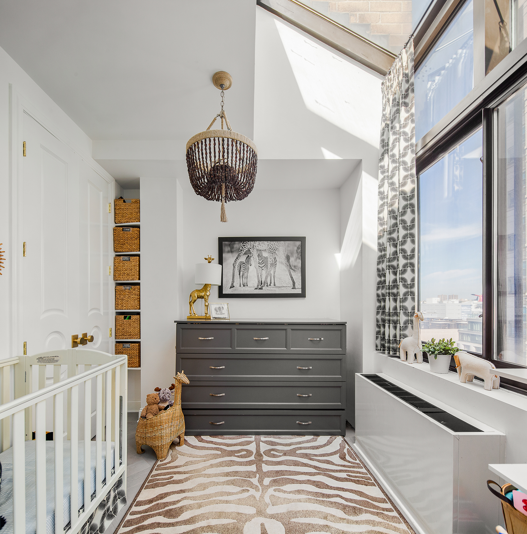 529 West 42nd Street, Unit 9R Manhattan, NY 10036 - Photo 5 of 10 a view of entryway with a chandelier fan and windows