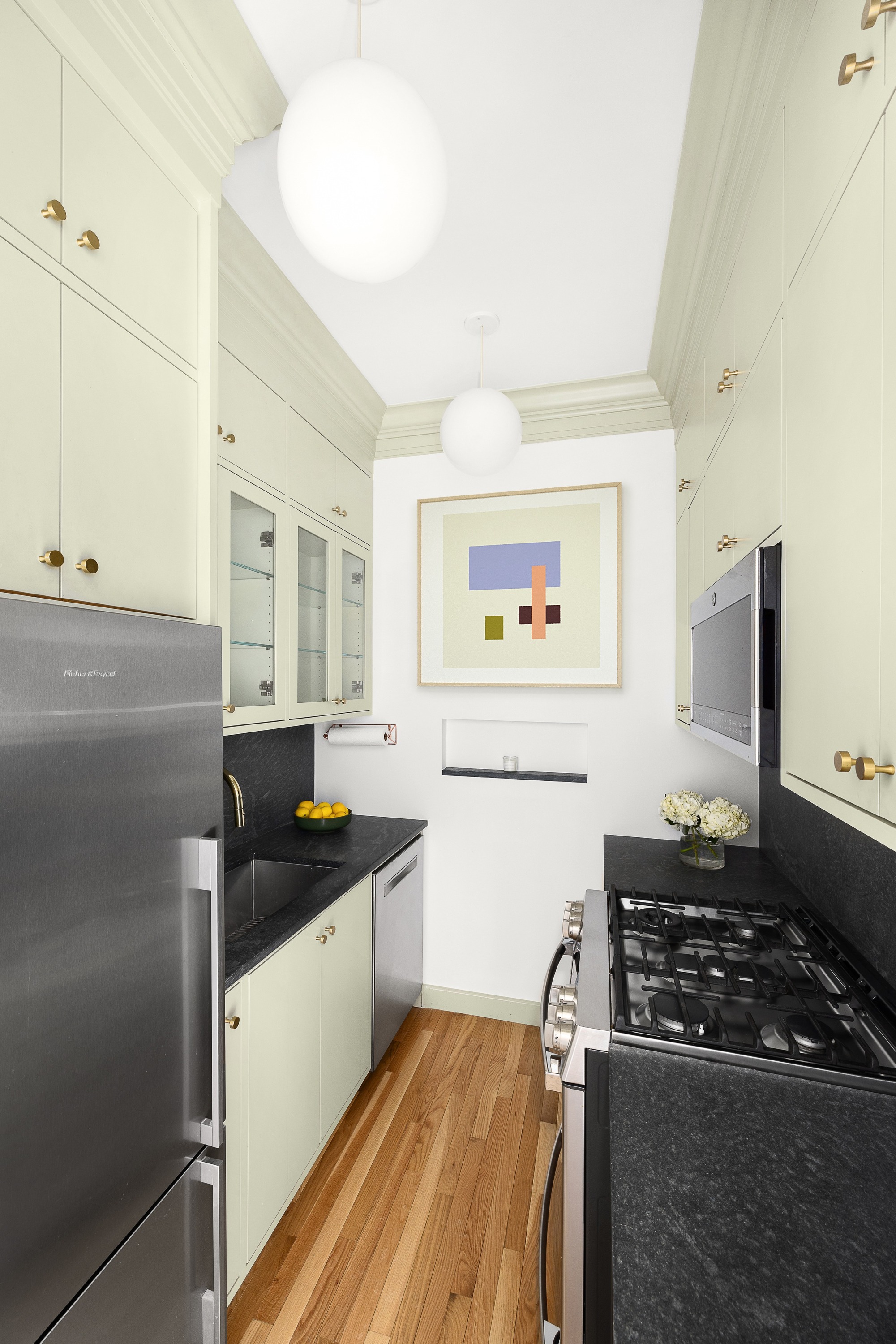 135 Prospect Park Southwest, Unit A6 Brooklyn, NY 11218 - Photo 4 of 10 a kitchen with a stove and a refrigerator
