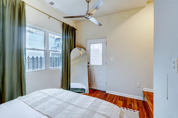 a bedroom with bed and window