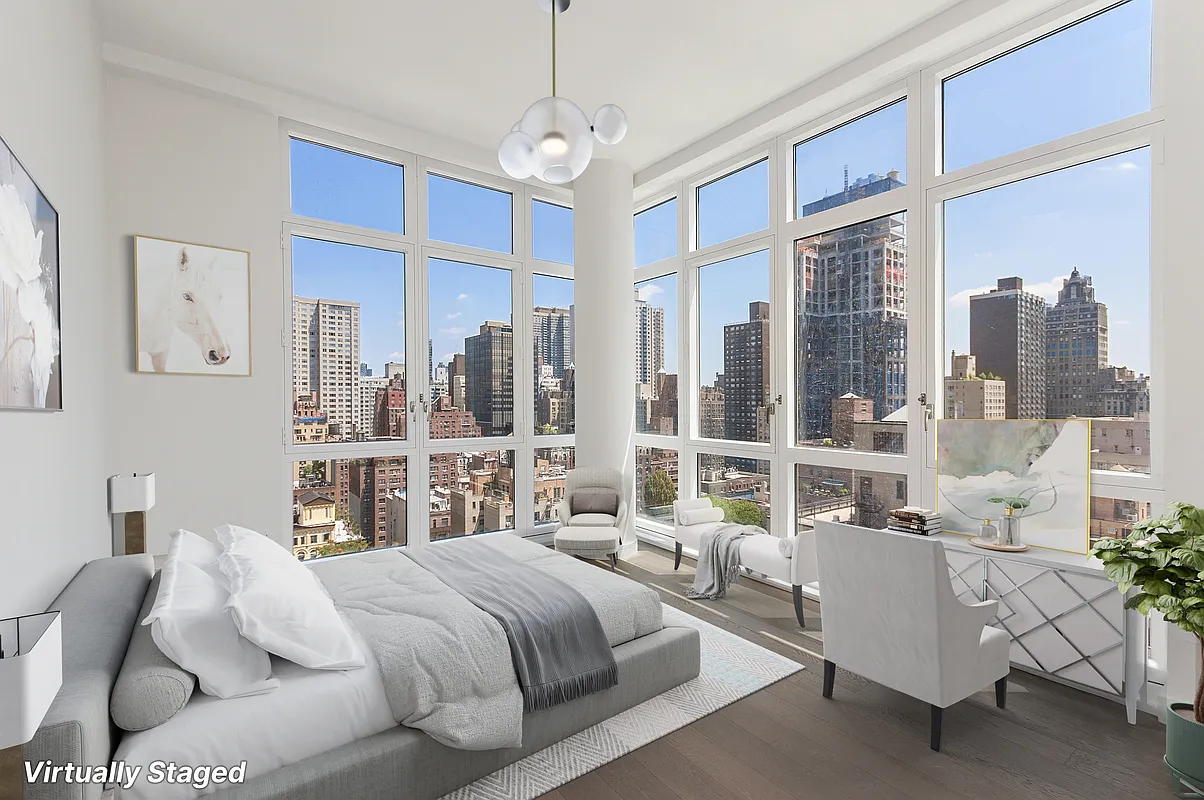 305 East 51st Street, Unit 14F Manhattan, NY 10022 - Photo 6 of 19 a spacious bedroom with a bed and a large window