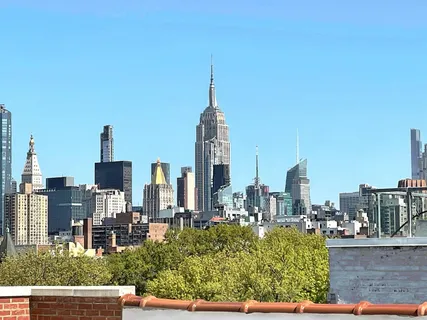 a view of a city with tall buildings