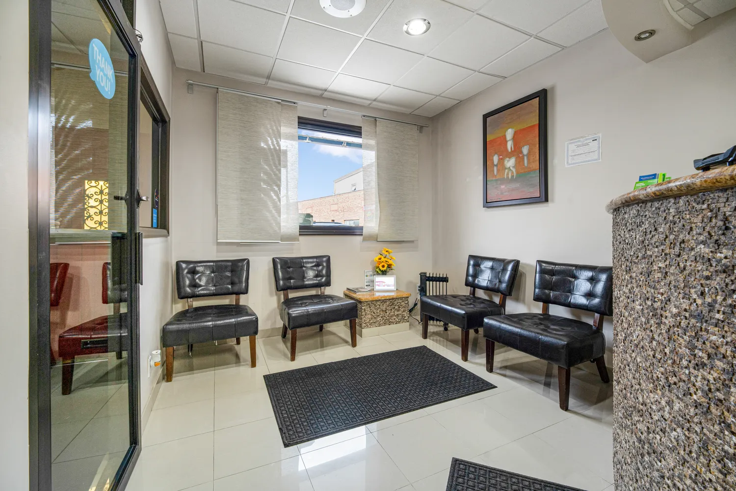 a kitchen with a table and chairs