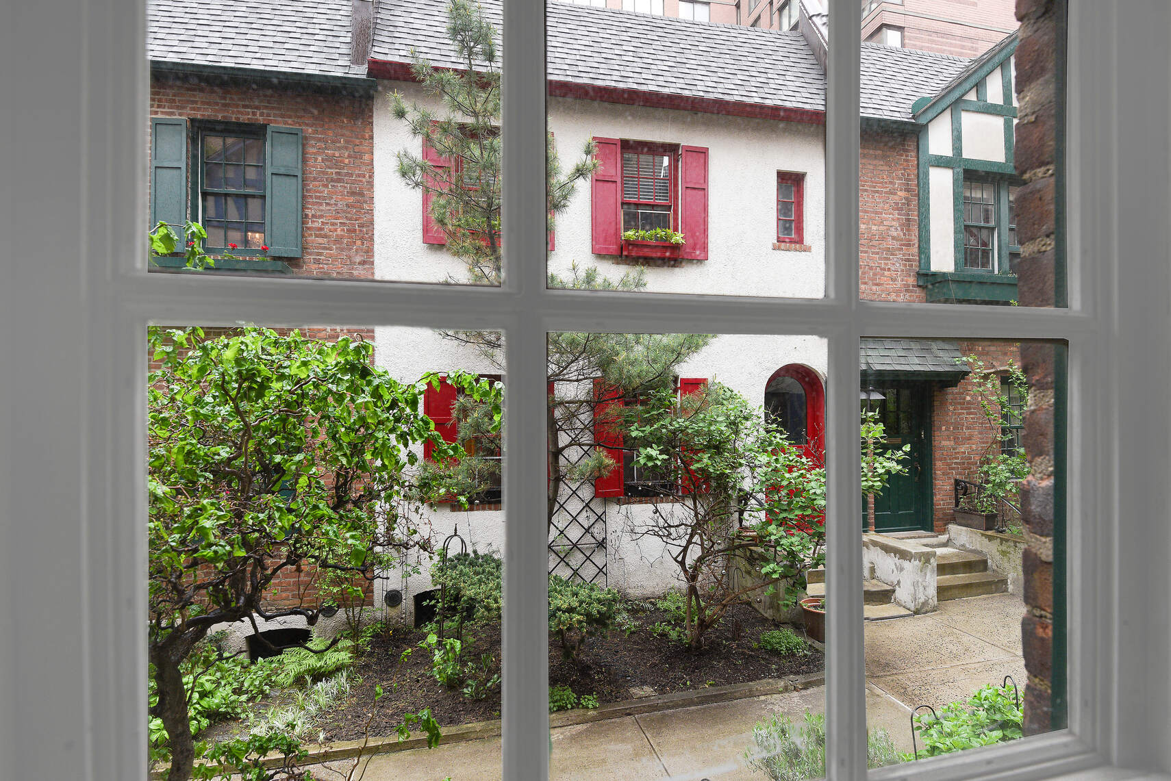 19 Pomander Walk, Unit 1 Manhattan, NY 10025 - Photo 1 of 10 a front view of house and outdoor space