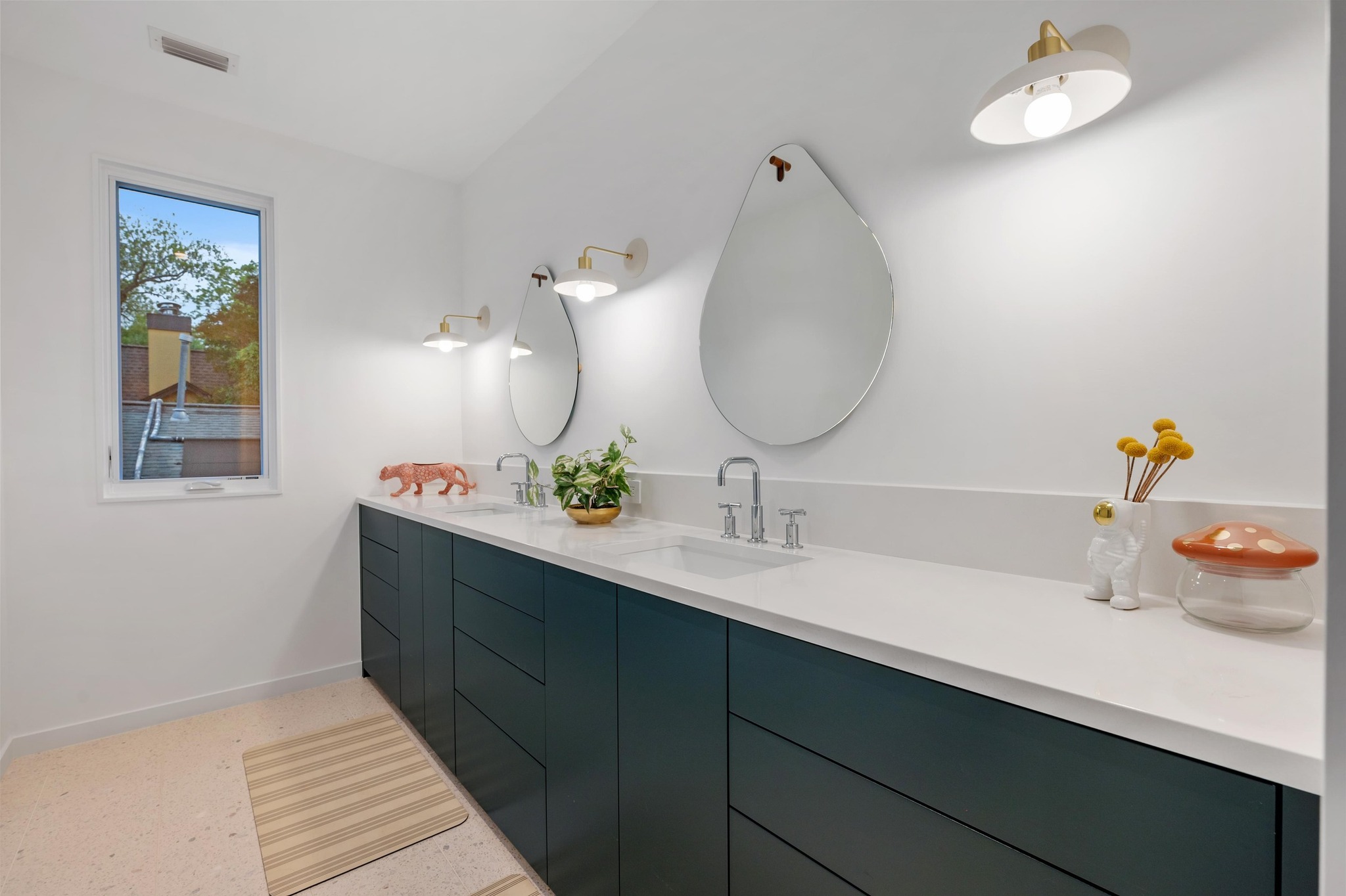 1206 Bickler Road Austin, TX 78704 - Photo 52 of 65 a bathroom with a sink and a mirror