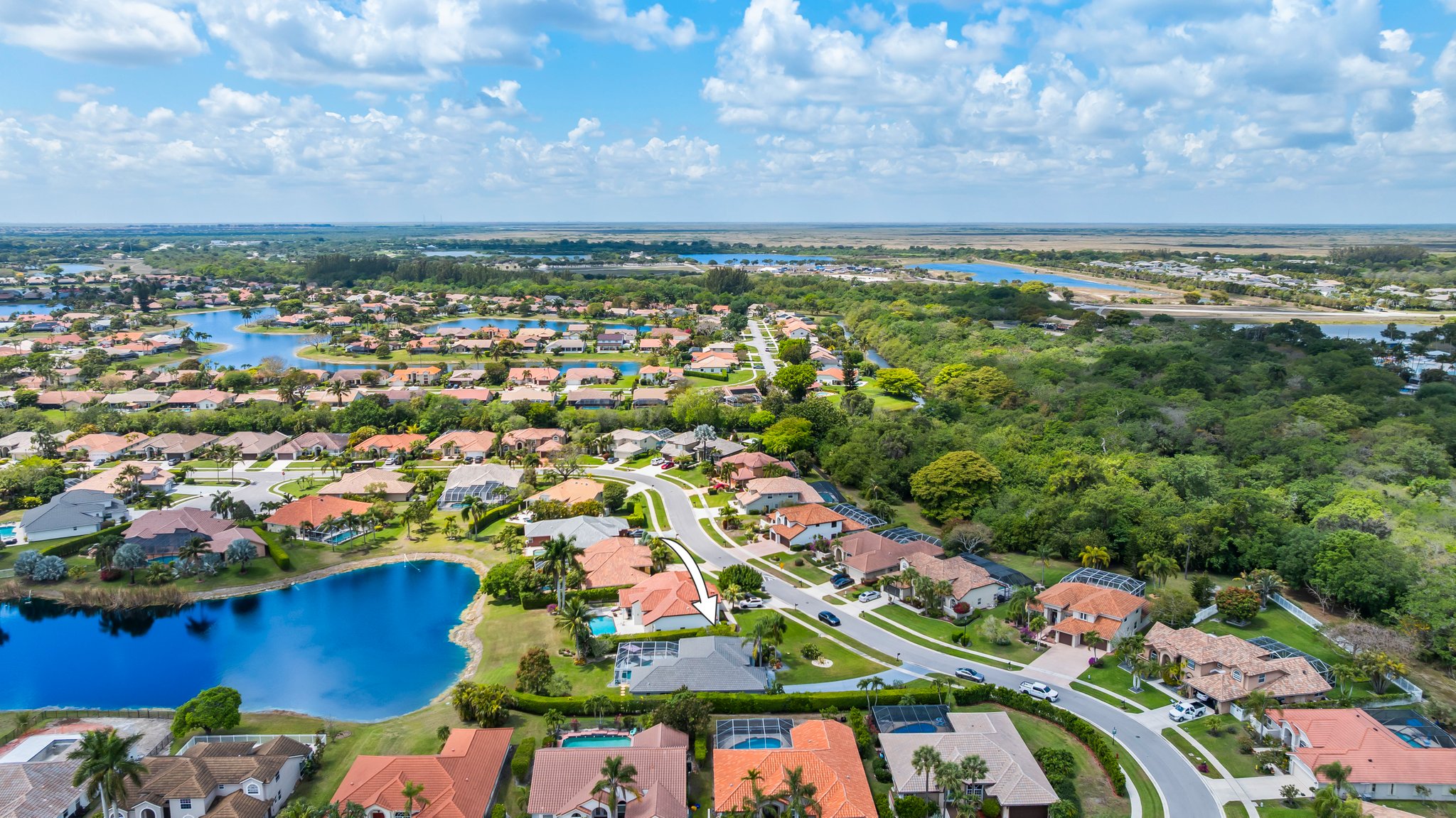 20317 Hacienda Court Boca Raton, FL 33498 - Photo 70 of 100 an aerial view of residential houses with outdoor space and trees
