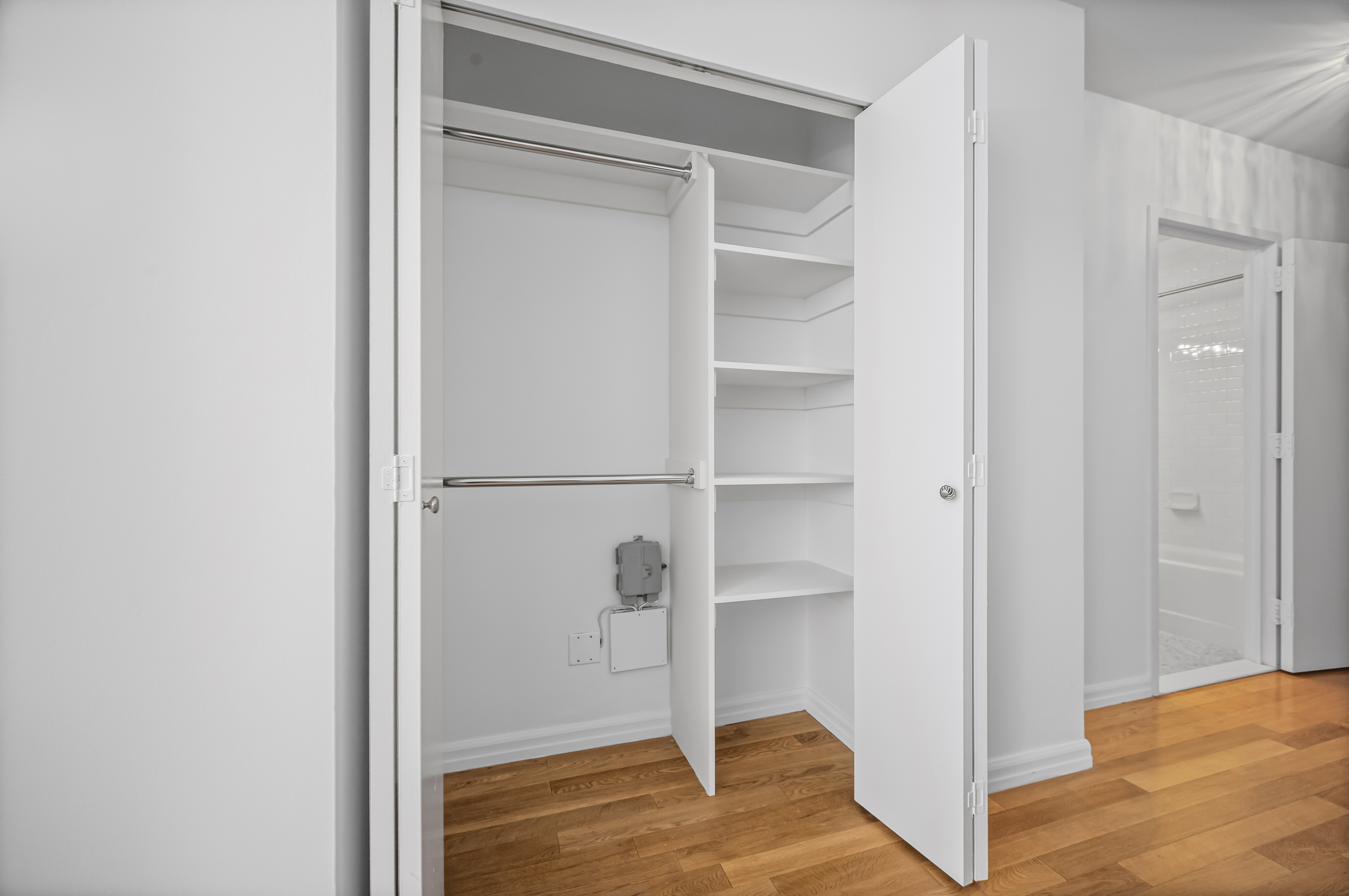 99 John Street, Unit 920 Manhattan, NY 10038 - Photo 7 of 18 a view of a room with wooden floor