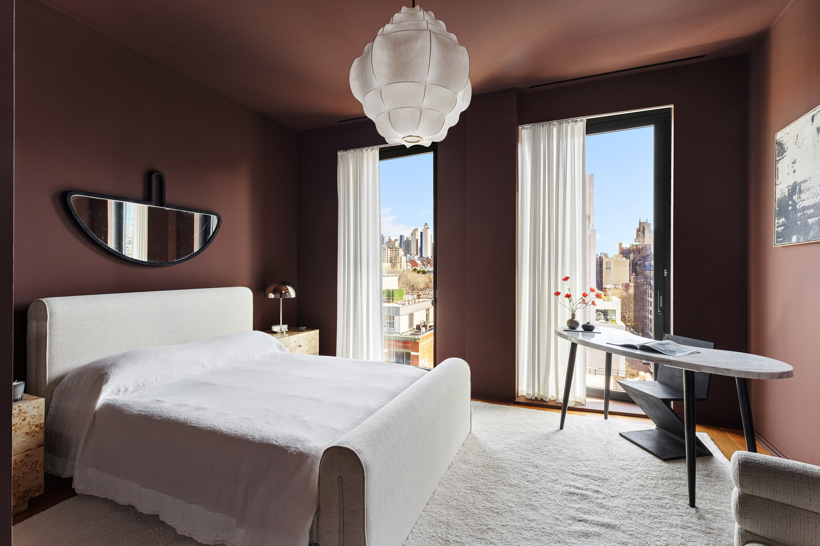 505 West 19th Street, Unit PH1 Manhattan, NY 10011 - Photo 23 of 26 a bedroom with a bed and a chandelier