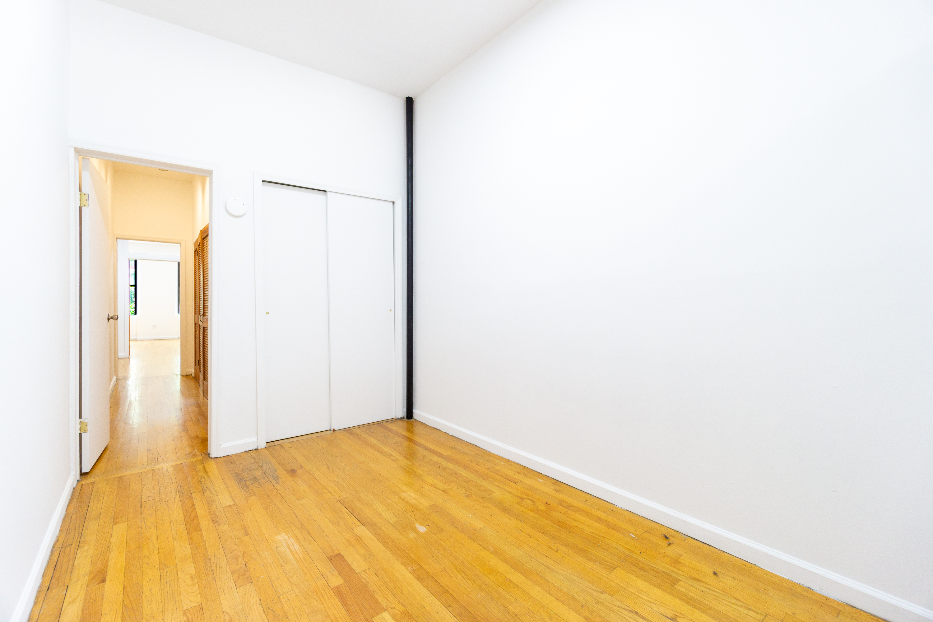 215 East 5th Street, Unit 3 Manhattan, NY 10003 - Photo 10 of 25 a view of a big room with wooden floor