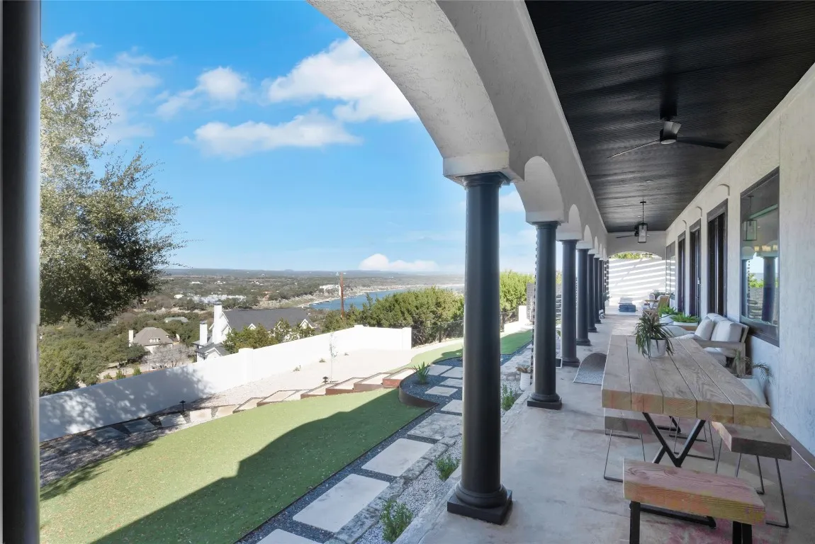 a living room with fireplace furniture and a chandelier