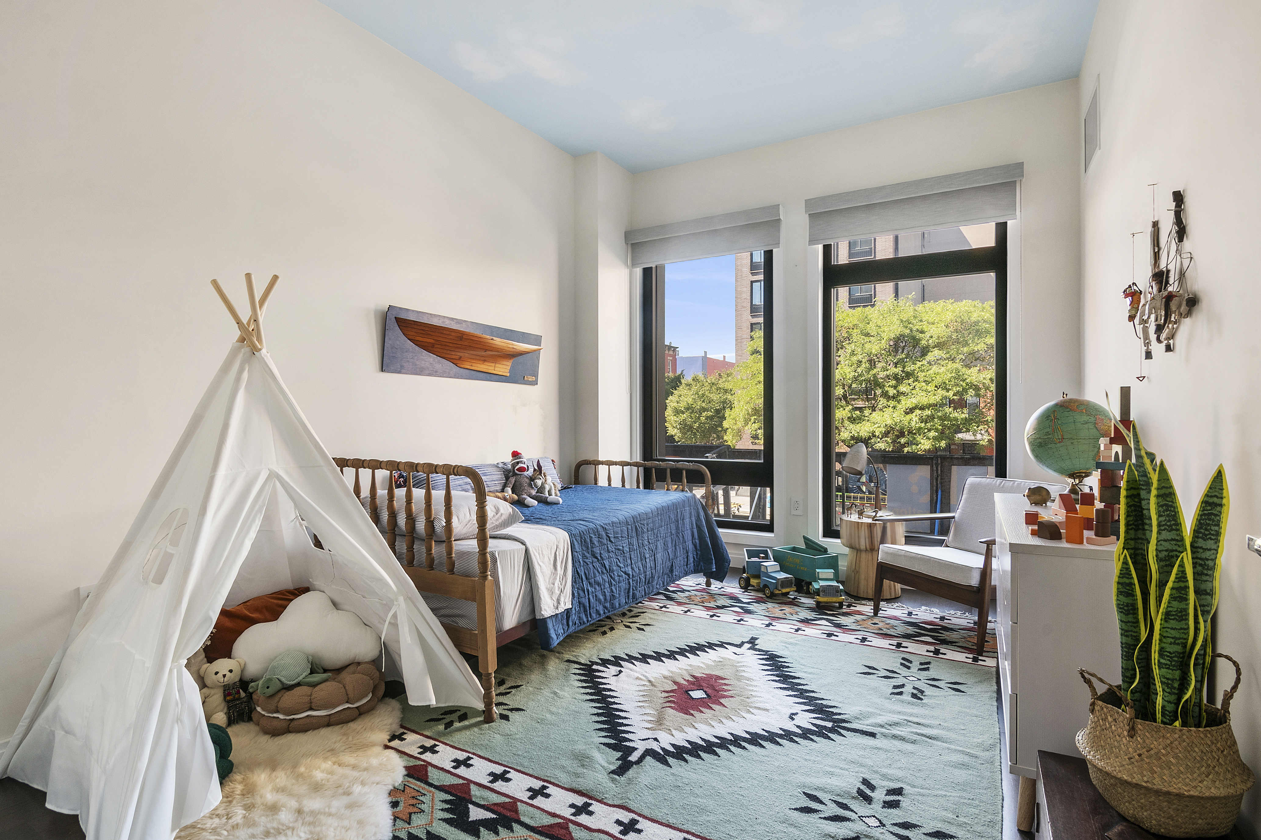 613 Baltic Street, Unit 2C Brooklyn, NY 11217 - Photo 7 of 16 a bedroom with furniture and a potted plant