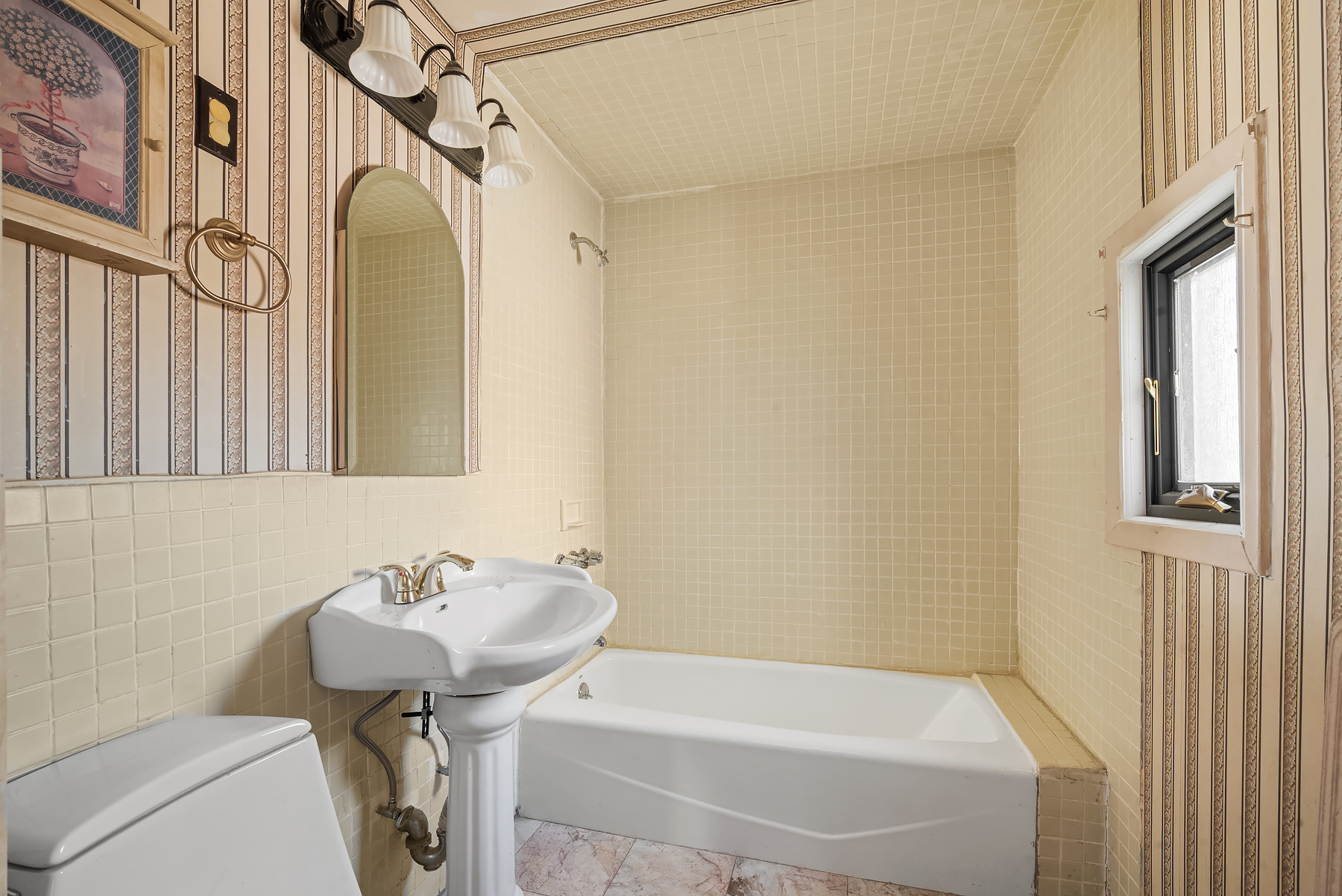 396 19th Street Brooklyn, NY 11215 - Photo 16 of 17 a bathroom with a sink a toilet and shower