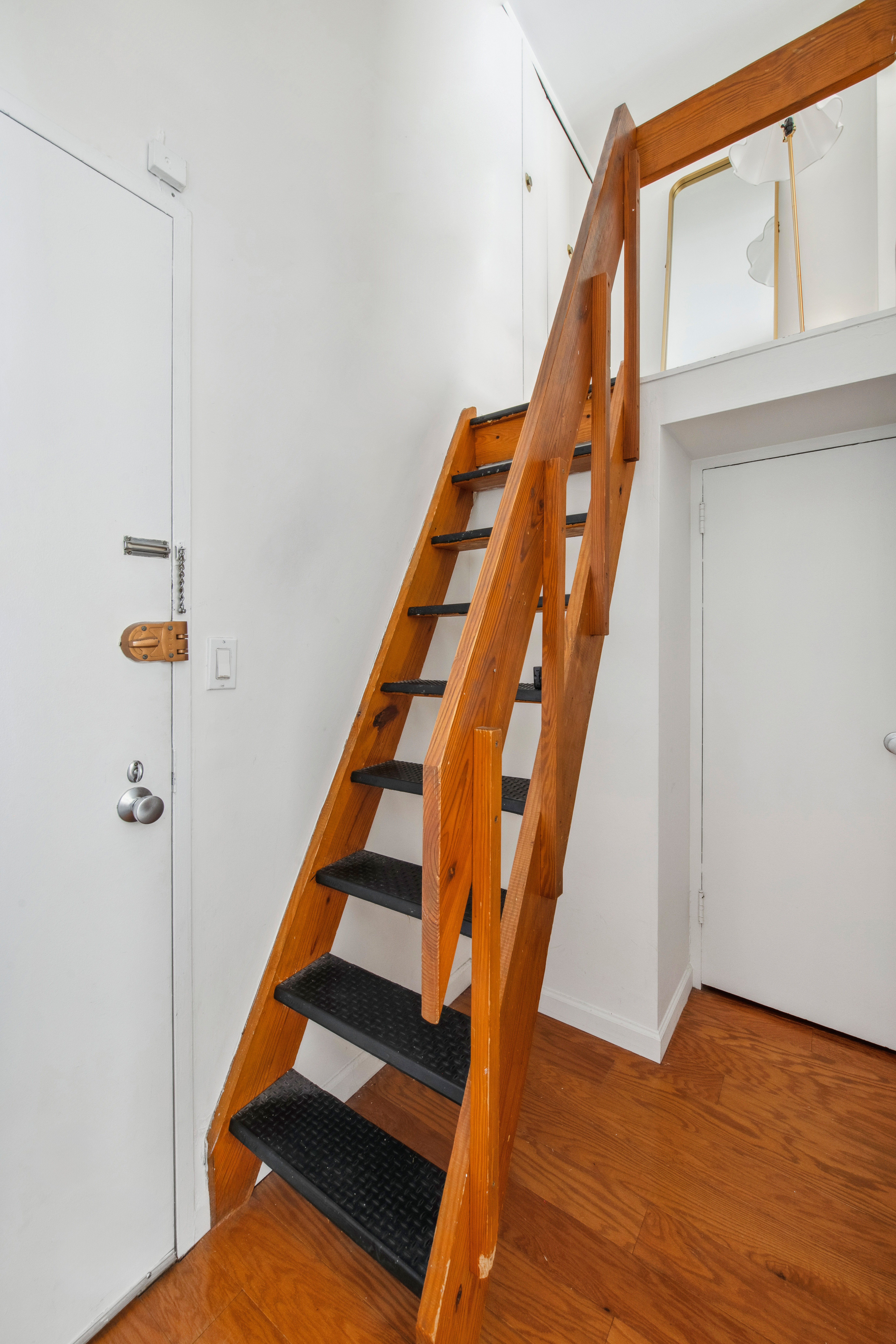 350 East 62nd Street, Unit 3J Manhattan, NY 10065 - Photo 5 of 9 a view of entryway with wooden floor
