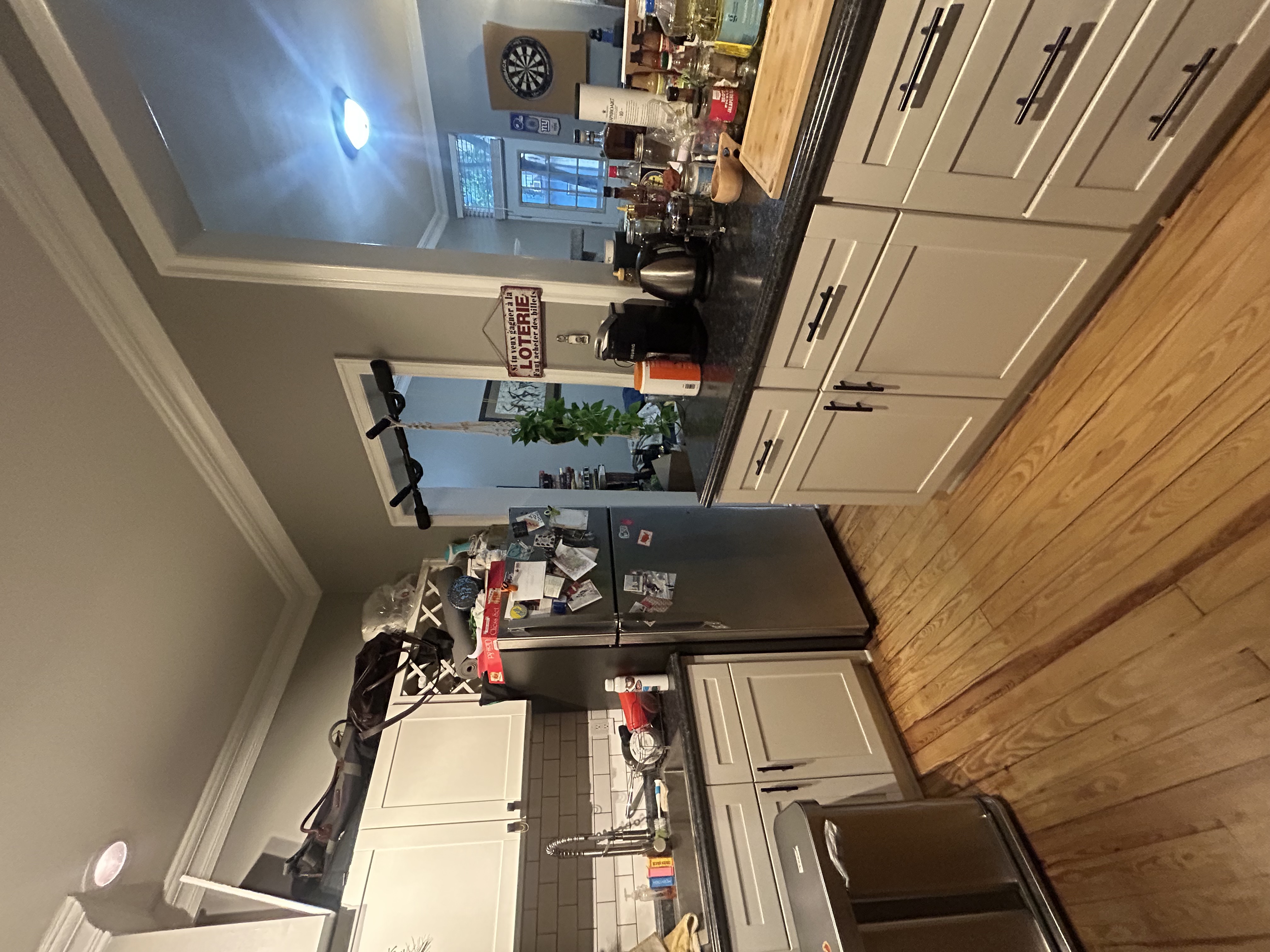 317 East 73rd Street, Unit 1RE Manhattan, NY 10021 - Photo 6 of 9 a kitchen with granite countertop a refrigerator and a stove top oven