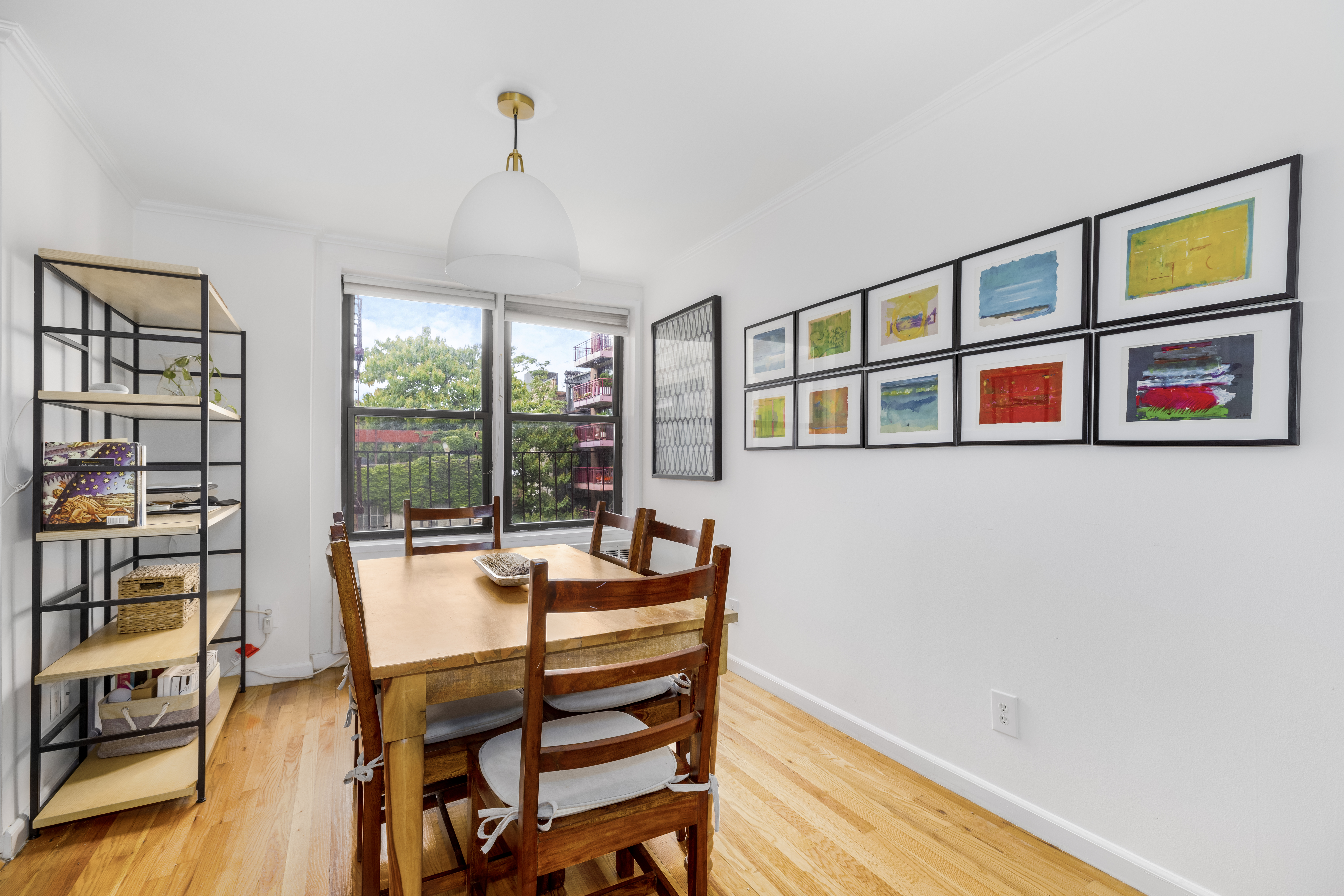 165 Christopher Street, Unit 3A Manhattan, NY 10014 - Photo 3 of 8 a outdoor space with patio furniture and a window