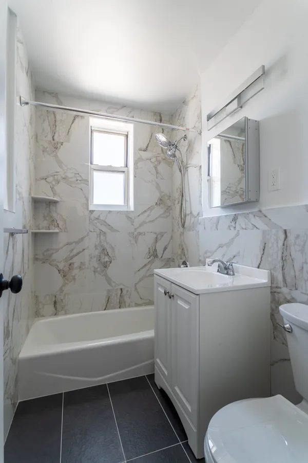 a bathroom with a sink toilet and bathtub