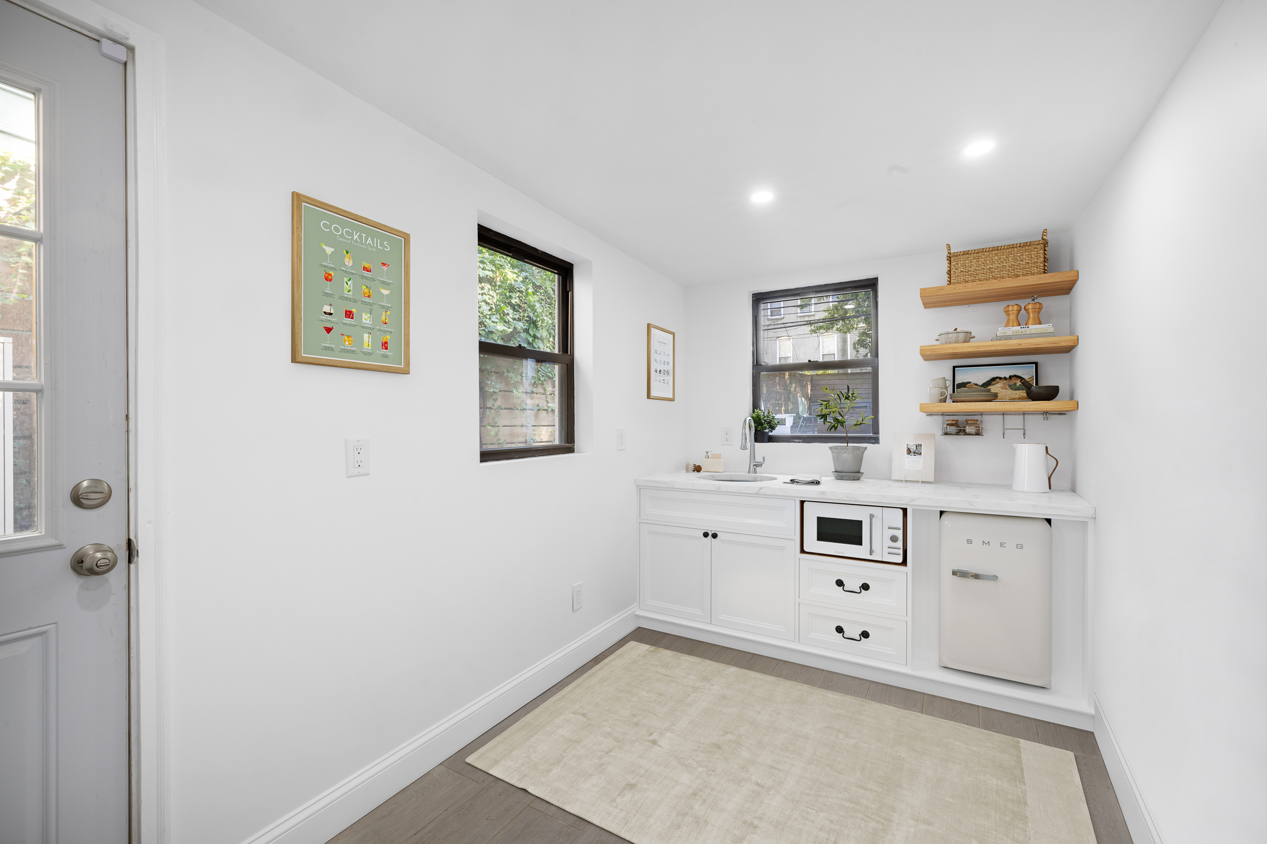 716 Monroe Street Brooklyn, NY 11221 - Photo 20 of 22 a view of room with window and cabinet