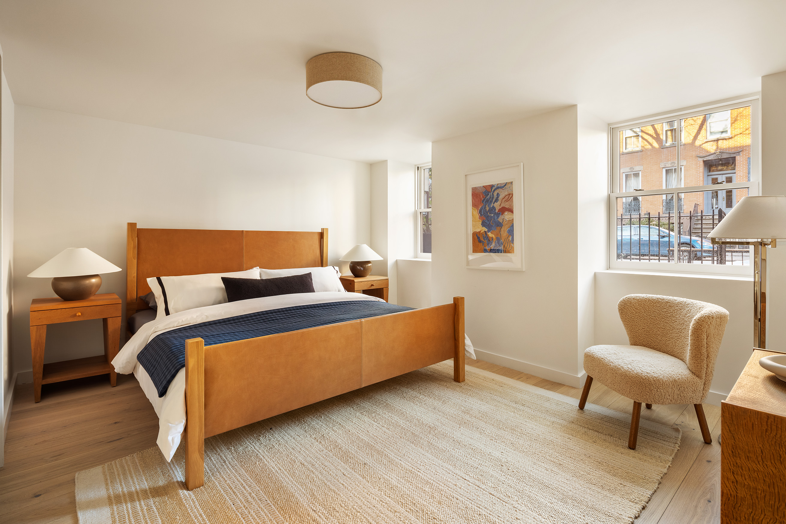238 Degraw Street, Unit 1 Brooklyn, NY 11231 - Photo 6 of 13 a bedroom with a bed and a couch next to a window