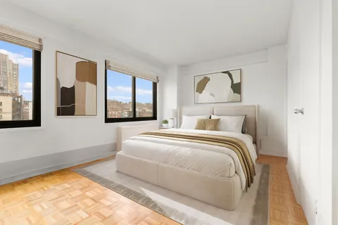 a bedroom with a large bed and a window