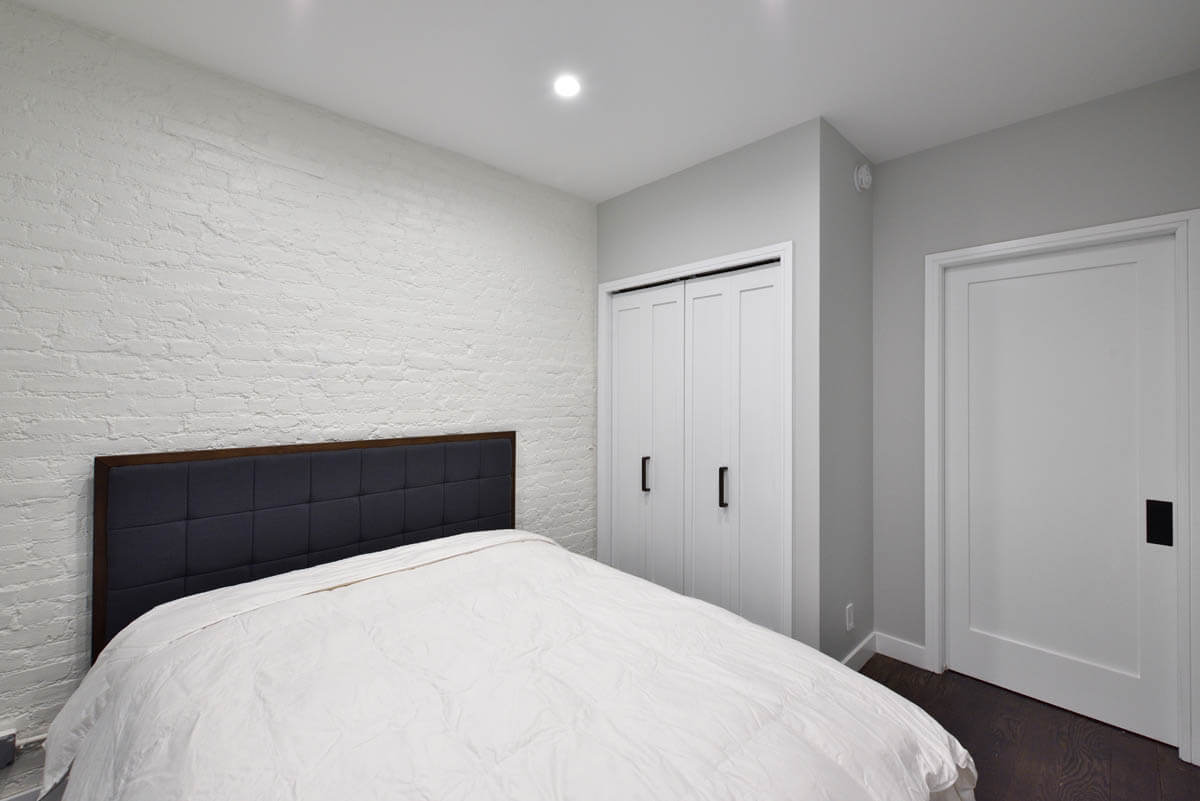 124 Thompson Street, Unit 11/12 Manhattan, NY 10012 - Photo 8 of 13 a bedroom with a bed and a closet