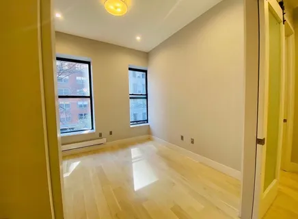 a view of an empty room with windows