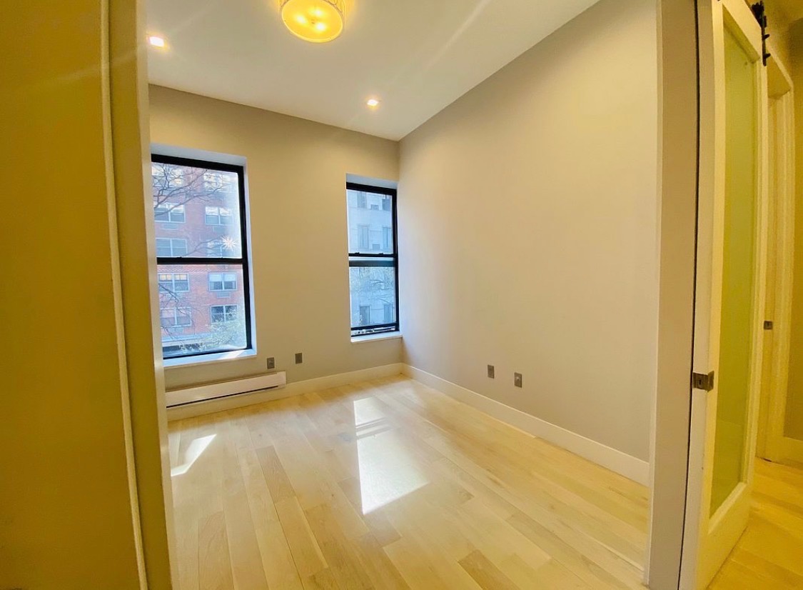133 East 35th Street, Unit 3 Manhattan, NY 10016 - Photo 14 of 16 a view of an empty room with windows