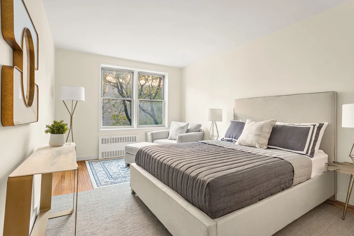 a bedroom with a large bed and a large window